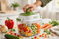 16-in-1 vegetable chopper in action with freshly diced vegetables